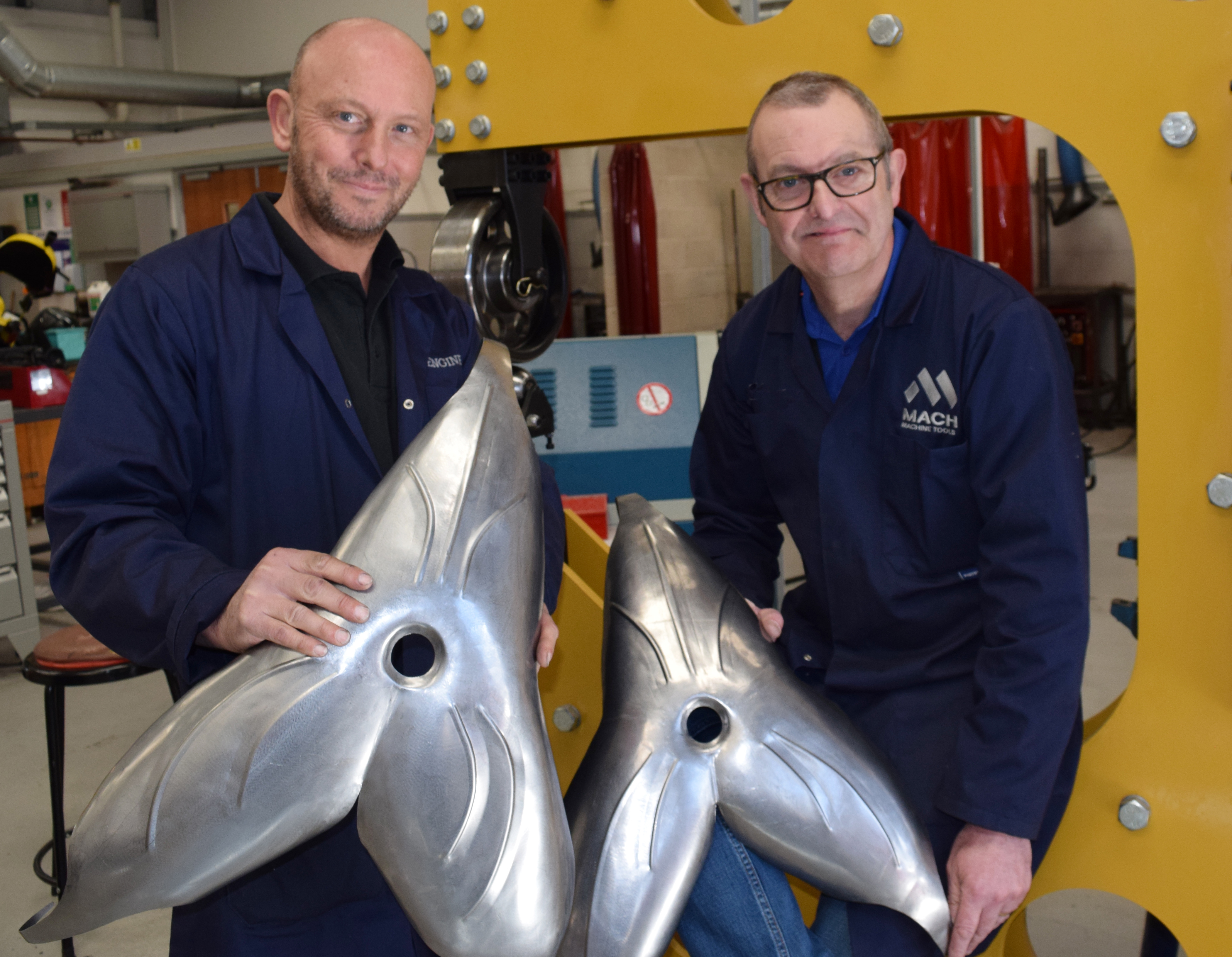 L-R Andy Caie and Steve Pask, Engineering Lecturers, with some of the steel flowers